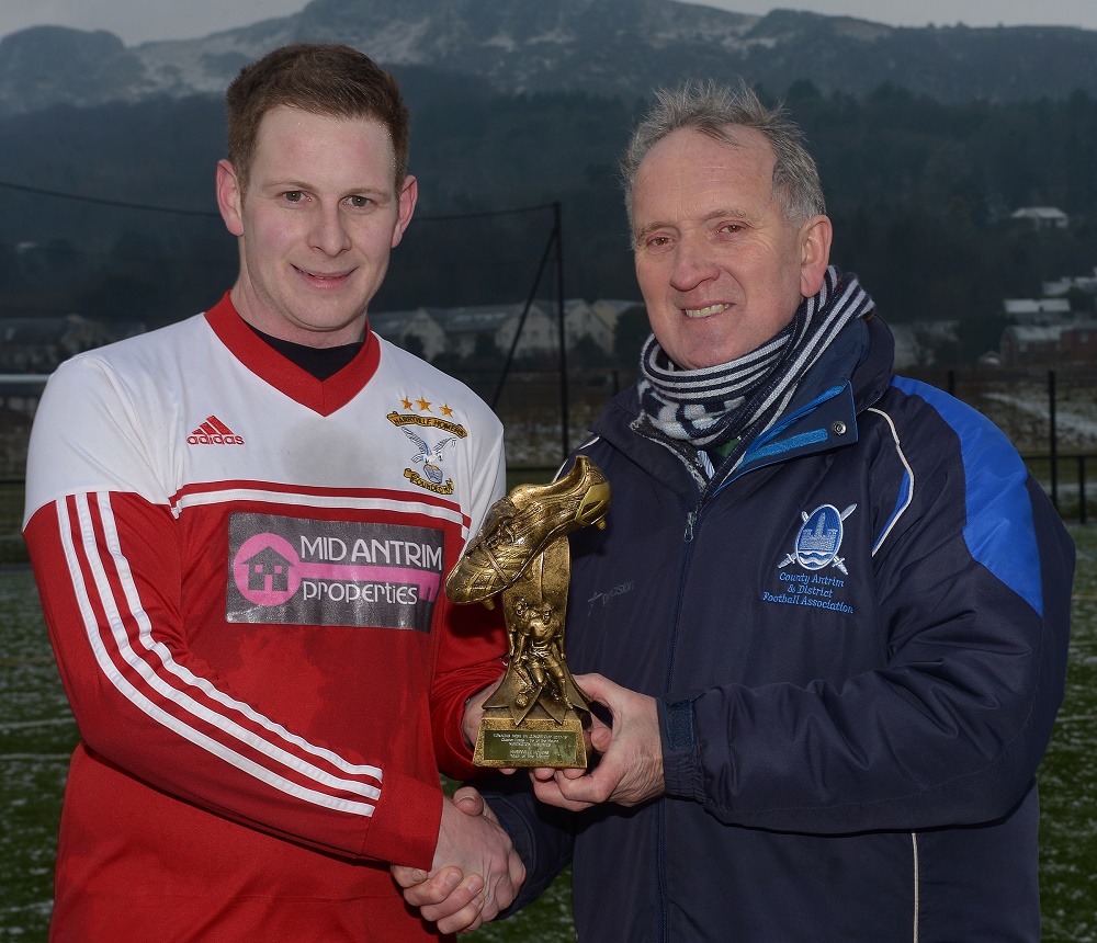Paul McNeill receives his man of the match award from Robert Donaghy, IFA Junior Committee.jpg