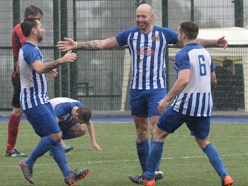 Andy Reay celebrates with his teammates.jpg