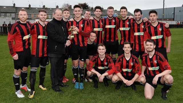 Man of the Match Stephen McCavitt with his teammates and Intermediate Cup chairman Colin McCullough.jpg 