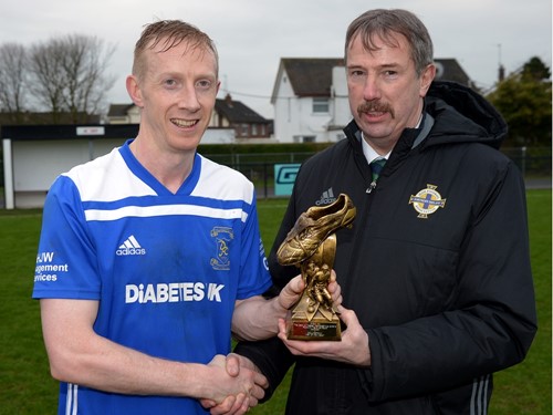 Dollingstowns Glenn Hand recieves his %22Man of the Match%22 trophy from Irish FA Intermediate Committee Member Alistair Gray.jpg