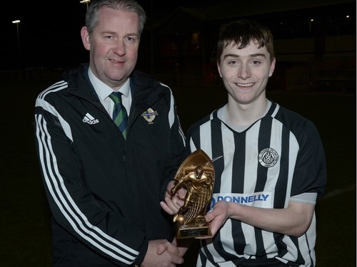 Chairman of the Irish FA Junior and Youth Committee Maurice Johnston presenting the Man of the Match trophy to Calvin McCurry.jpg