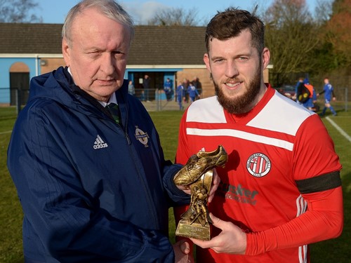 Desi Bradley of the Irish FA Junior Committe presents Pearse Devine of Willowbank with his Man of the Match Trophy.jpg