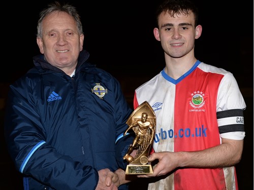 Robert Doherty of the Irish FA Youth Committee presents Jake Corbett of Linfield Rangers with his MOM trophy.jpg