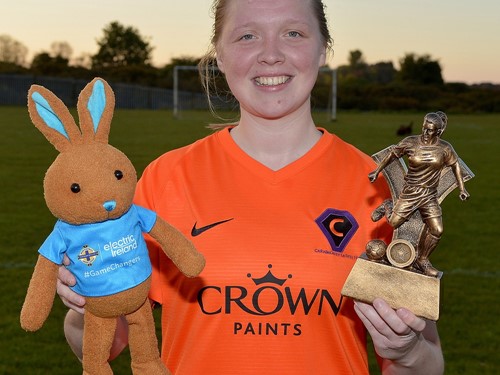 Hollie Johnston with her 'player of the match' trophy and Electric Ireland bunny.jpg