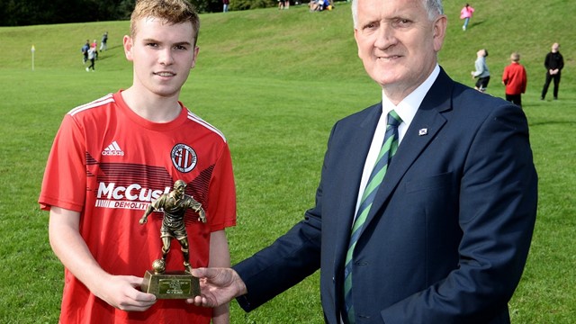 Man of the Match Lee McAllister receives his trophy from Robert Doherty of the Irish FA Junior Committee.jpg 