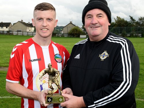 Man of the Match Michael Gallagher receives his award from IFA Junior Committee member Davy King.jpg
