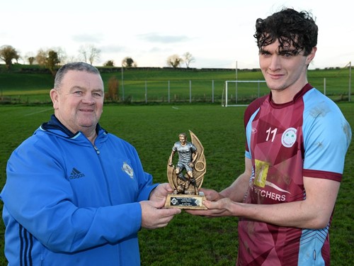 IFA Junior Committee member Enda Love presents Kyle McCrory with the man of the match trophy.jpg