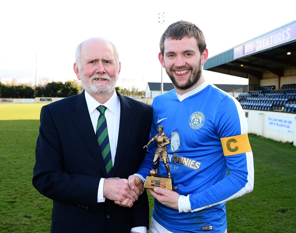 Gerry Stewart of the Irish FA Intermediate Cup Committee presents Limavady Utd's Captain Hugh Carlin with the Man of the Match Trophy  (002).jpg