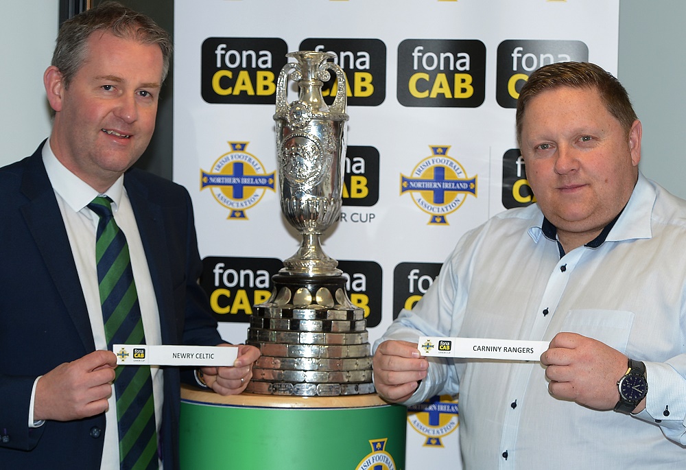 Maurice Johnson (Chairman of the Irish FA Junior Committee) and Simon Kitchen (Business Development Manager of fona CAB) display the tie of the round.jpg