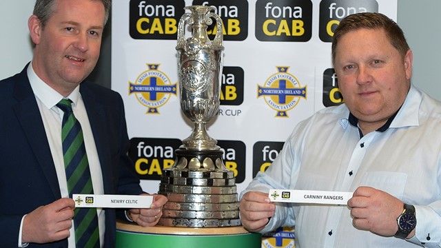 Maurice Johnson (Chairman of the Irish FA Junior Committee) and Simon Kitchen (Business Development Manager of fona CAB) display the tie of the round.jpg 