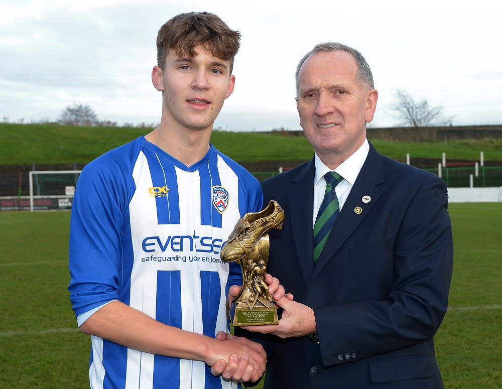 Ben Wilson receives his Man of the Match award from IFA Youth Committee member Robert Doherty.jpg (1) Ben Wilson receives his Man of the Match award from IFA Youth Committee member Robert Doherty.jpg (1)