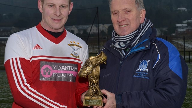 Paul McNeill receives his man of the match award from Robert Donaghy, IFA Junior Committee.jpg 