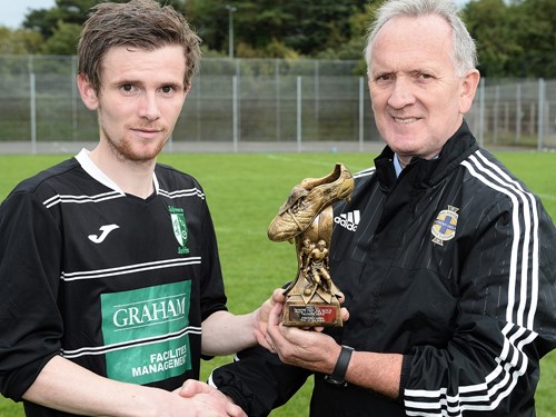 Thomas Murray of Tullymore Swifts with IFA Junior Committee member Robert Doherty.jpg