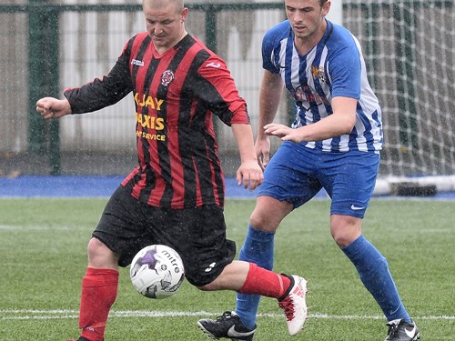 Derryhirk's Michael O'Hehir shields the ball.jpg