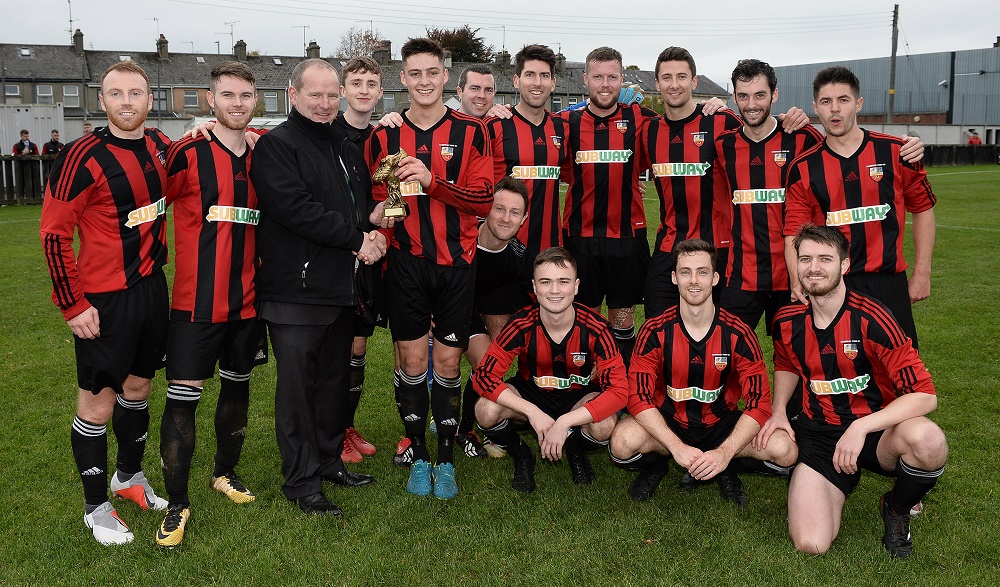 Man of the Match Stephen McCavitt with his teammates and Intermediate Cup chairman Colin McCullough.jpg