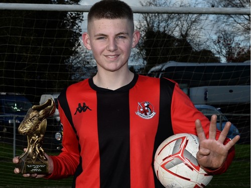 MOM James Holland with match ball and trophy.jpg