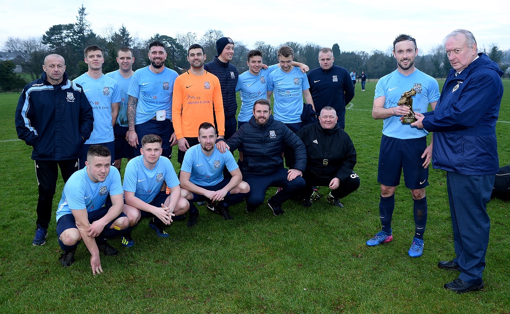 Man-of-the-Match Gregg Harrison with Desi Bradley, IFA Junior Committee, and the Hill Street squad.jpg