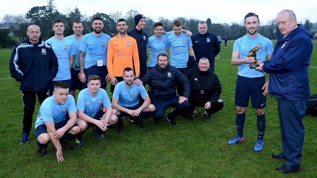 Man-of-the-Match Gregg Harrison with Desi Bradley, IFA Junior Committee, and the Hill Street squad.jpg 