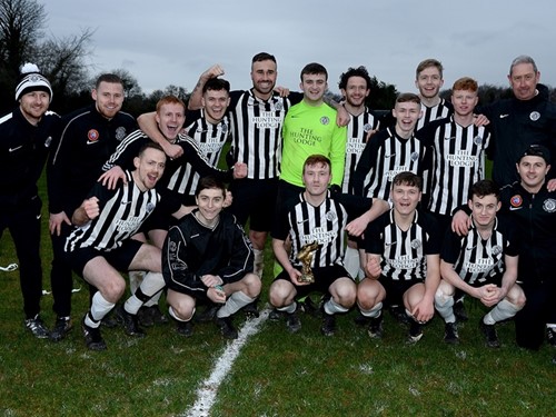Man of the match Ciaran Reid celebrates with his team mates.jpg