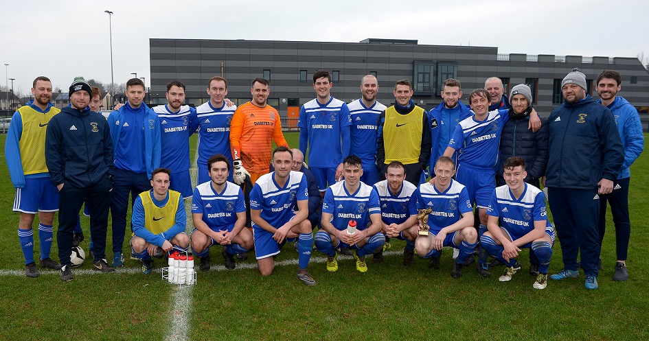 Dollingstown celebrate with man of the match Glenn Hand.jpg