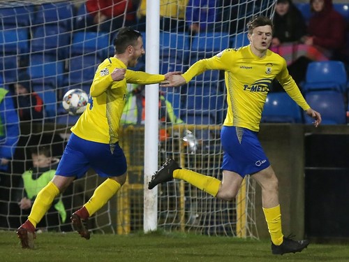 Paul McElroy (right) celebrates scoring Dungannon's winner.jpg