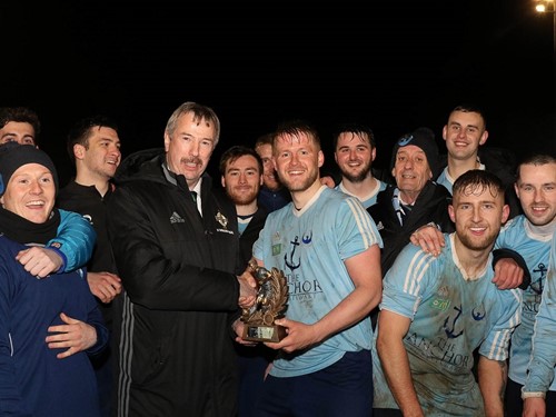 Portstewart's Karl Steele receives his Man of the Match Award from IFA Intermediate Committee member Alistair Gray.jpg