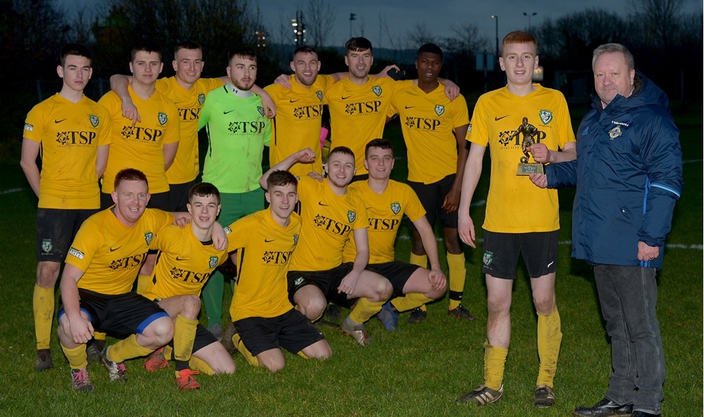 St James Swifts II's captain and  man of the match James Muir is presented with his trophy by Jim Jess, Chairman of Irish FA Junior and Youth Committee.jpg