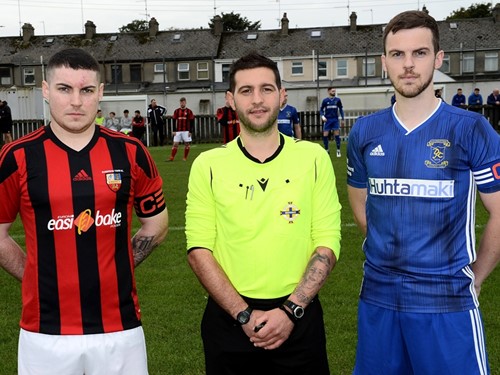 Banbridge Town captain Christopher McMahon, referee Gary Thompson and Dollingstown captain Patrick Mooney.jpg