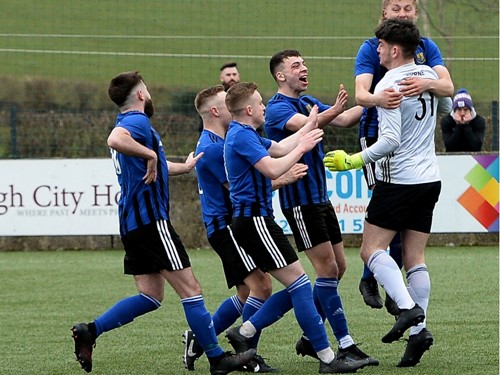 City celebrate with the man of the match Conner Byrne after winning the penalty shootout..jpg