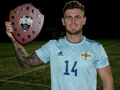 Anto Burns holds the Regions Cup Shield.jpg
