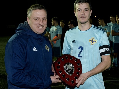 Andy Johnson of the Irish FA Presents Scott McMillan with the winning regions trophy.jpg