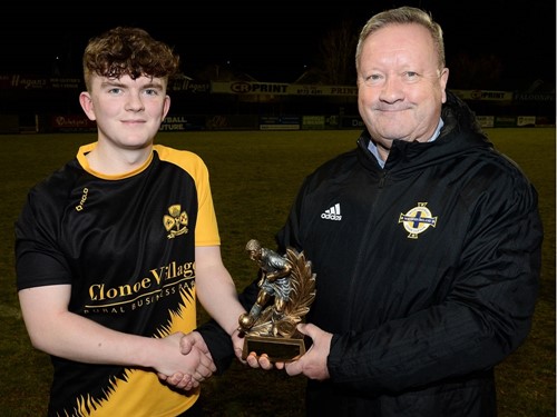 Irish FA Junior Cup Committee Chairman Jim Jess presents Coalisland Athletics Ciaran Magee with the man of the match trophy..jpg