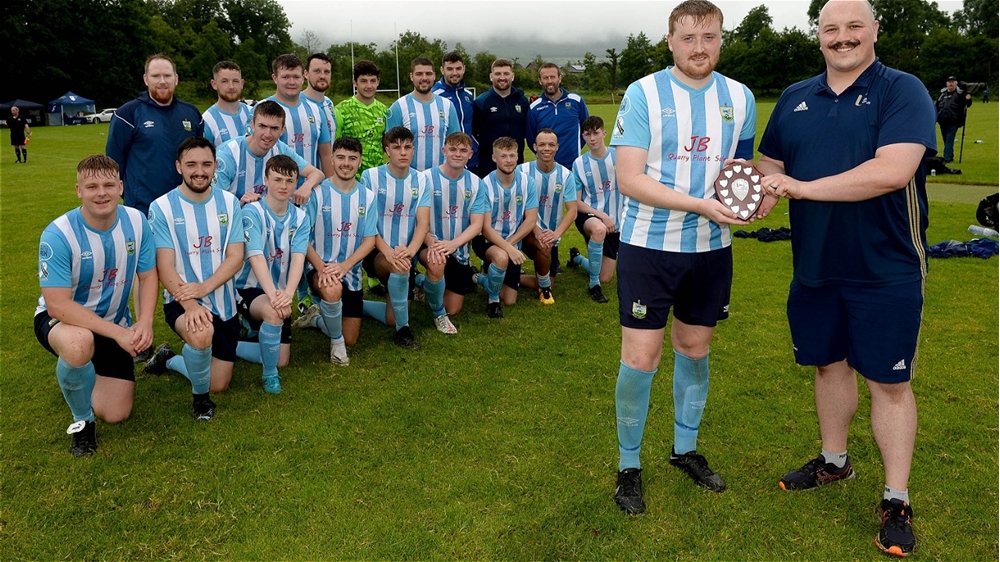 Ards Rangers Captain with Shield as team look on .jpg