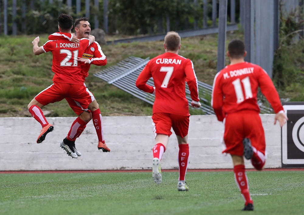Cliftonville players celebrate with David McDaid after his early goal.jpg