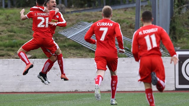 Cliftonville players celebrate with David McDaid after his early goal.jpg 