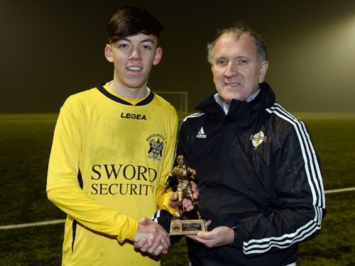 MOM Ryan Tweedy of Knockbreda with Robert Doherty of the Irish FA Junior and Youth Committee (002).jpg